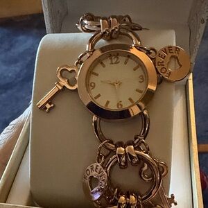 Rose gold bracelet watch.